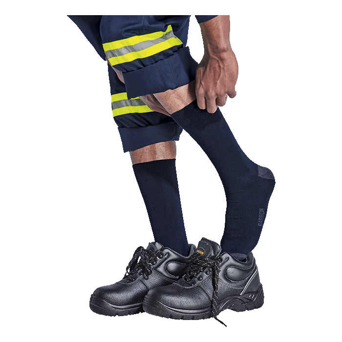 Navy duty socks with Barron logo worn with work pants and sneakers, crew length
