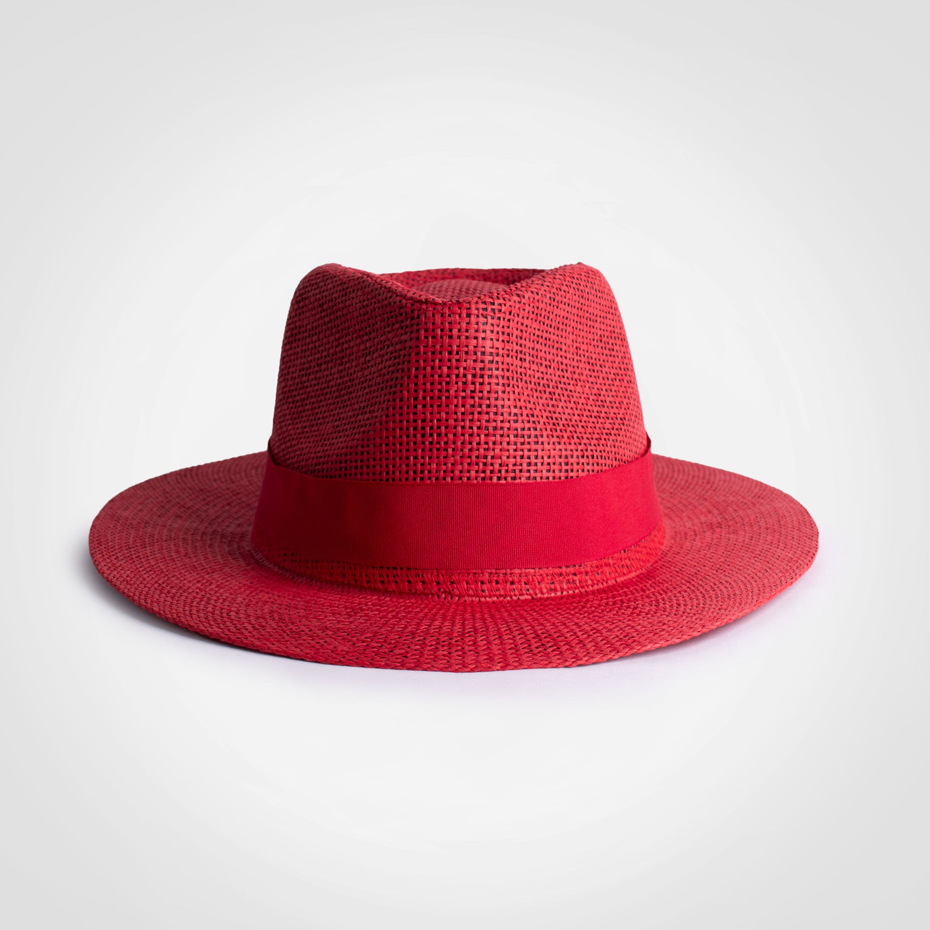Panama hat, red woven straw with dark band and wide brim