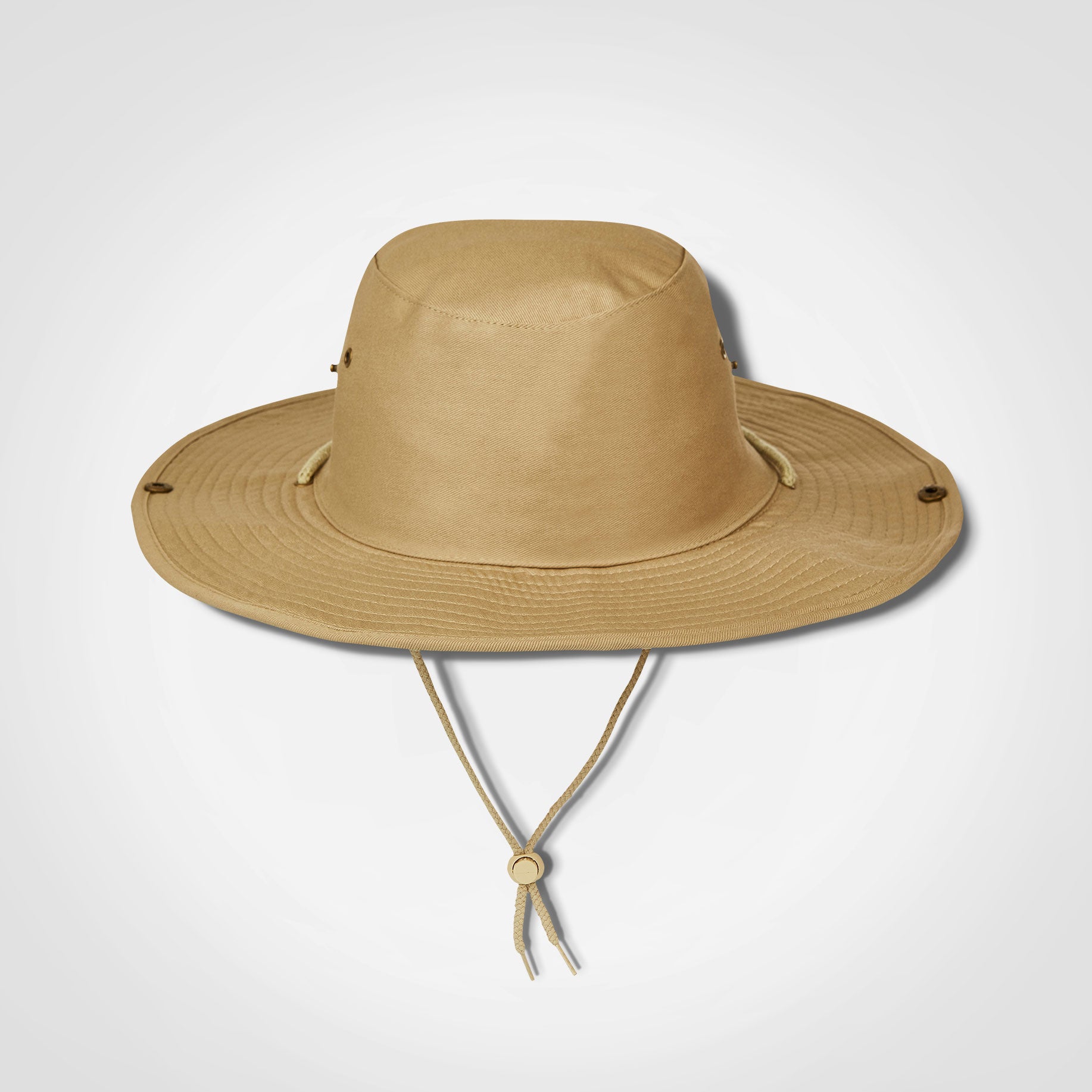 Light tan bush hat with wide brim and chin strap ties