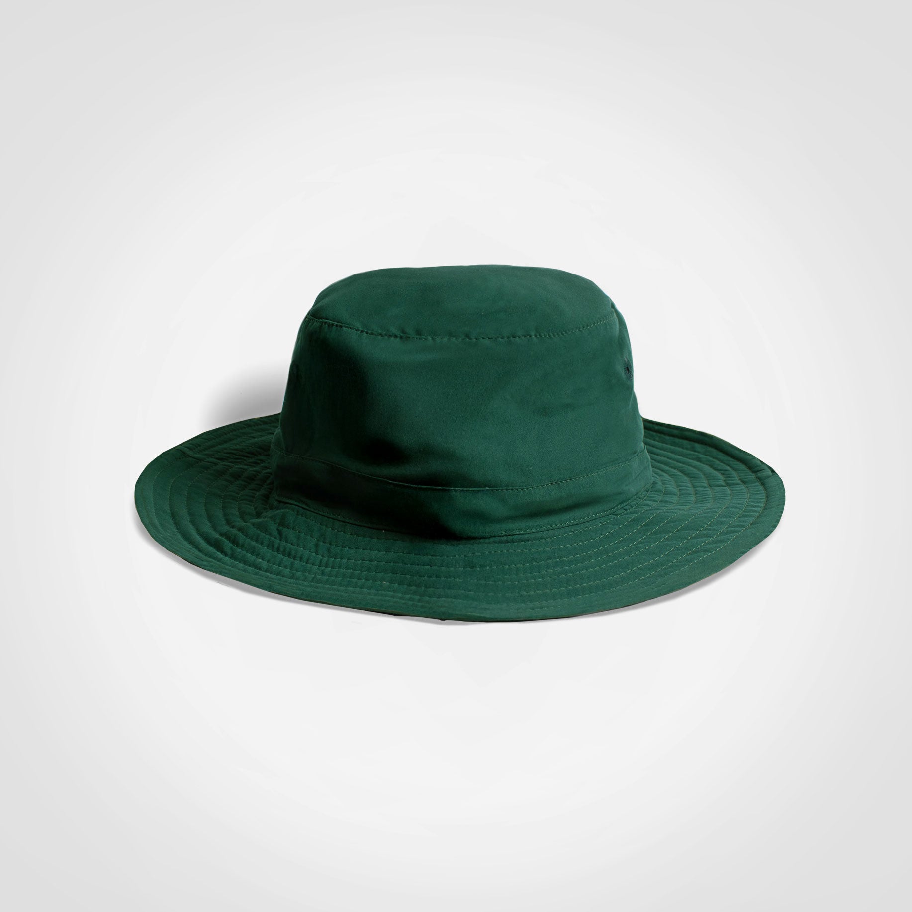Green kids bucket hat with wide brim and rounded crown