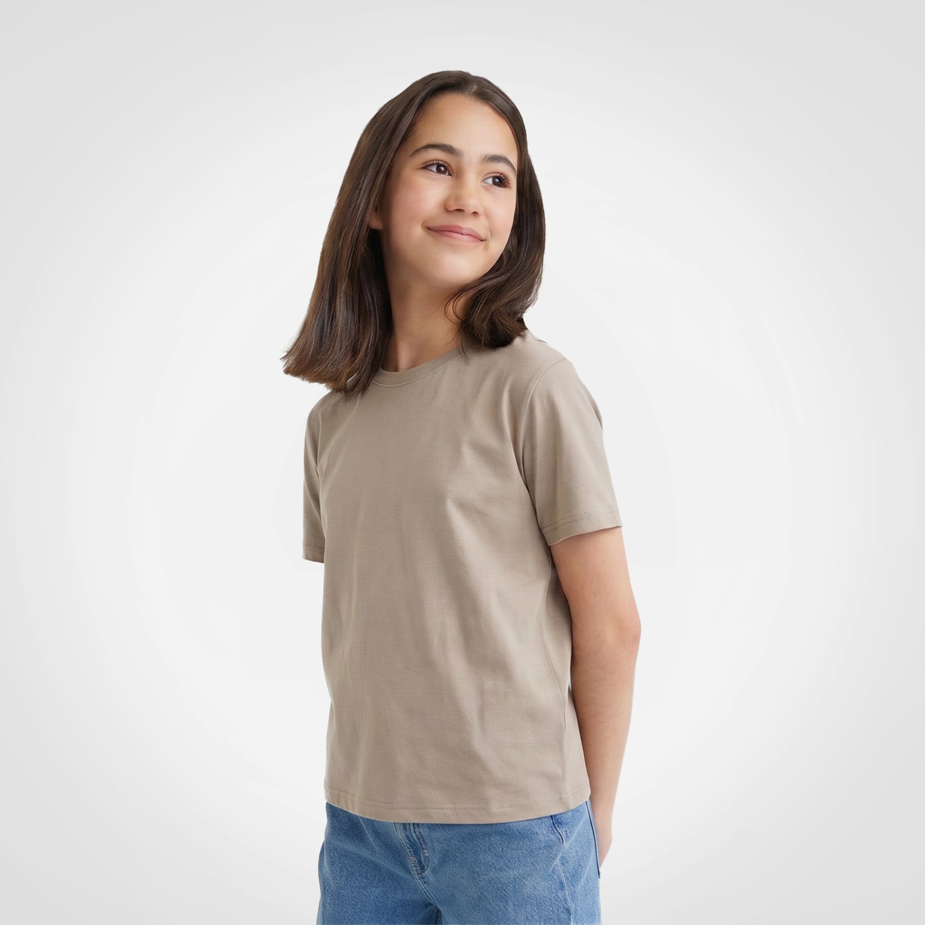 Kids t-shirt worn by a child, short sleeves, crewneck in tan (front view)