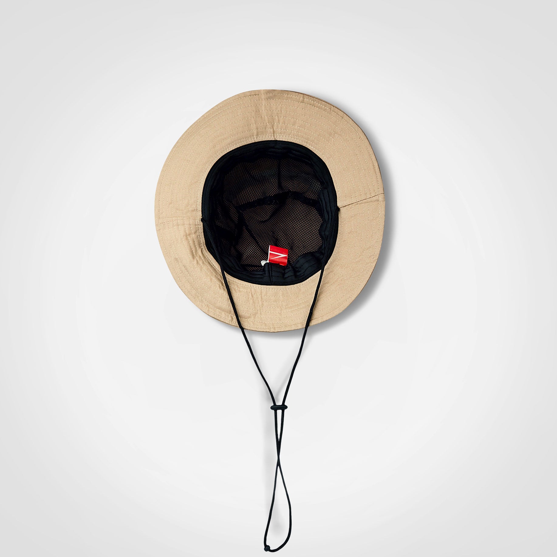 Beige Ranger hat with wide brim, black interior, and chin drawstring cords.